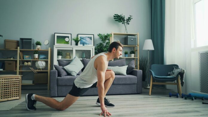 a man is doing push ups in a living room
